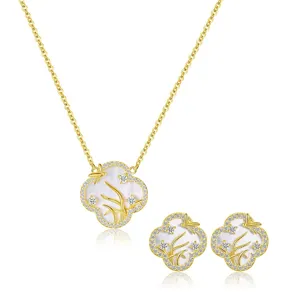 Close up of exquisite four leaf clover pendant necklace and matching earrings set jewelry detail
