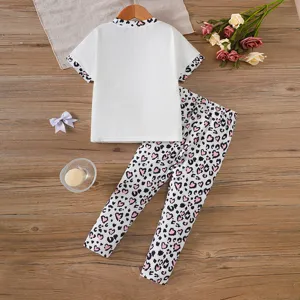 Flat lay arrangement of toddler girls white t-shirt and leopard heart leggings set