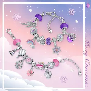Detailed view of Christmas DIY charm bracelets with festive pink and purple beads