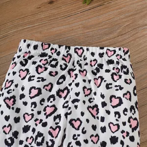 Detailed macro view of elastic waistband on girls pink heart leopard print leggings