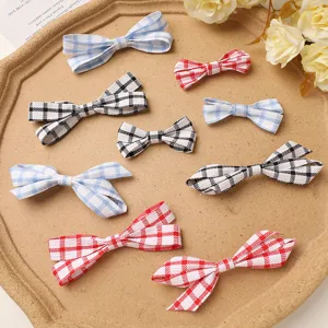 Close up of cute plaid fabric bows in assorted colors, perfect for DIY hair clips or accessory decor.