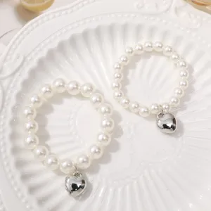 Elegant white imitation pearl bracelet with a cute silver heart pendant for daily sweet styling.