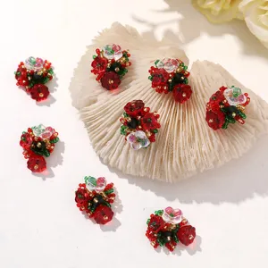 Red flower cluster DIY accessories for Christmas holiday earrings and hair clips detail view.