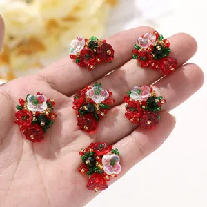 Close up details of red beaded flower cluster DIY accessories for festive crafts and jewelry making.