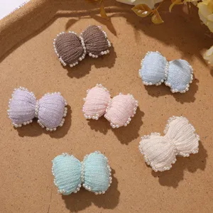 Cute chunky pastel pearl knit bow DIY hair clip accessory detail view showing multi colors