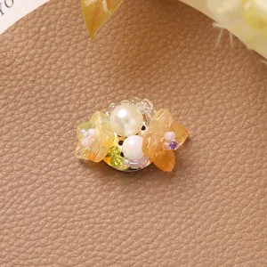 Handmade beaded flower charm DIY jewelry accessory for earrings hair clips and cute styling.