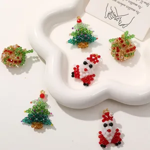 Christmas beaded charms set featuring tree wreath and santa pendant for DIY jewelry making.