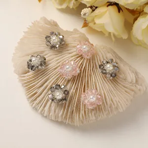 Close-up detail of handmade crystal flower DIY accessories with lovely faux pearls.