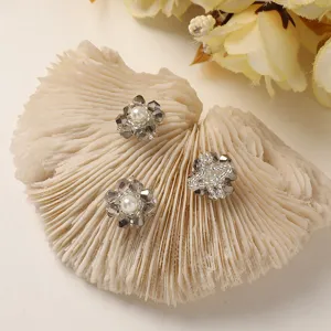 Detailed close-up of handmade crystal pearl flower DIY accessories, exquisite jewelry parts.