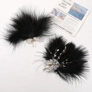 Black feather hair clip with pearl crystal bead butterfly design, handmade hair accessory detail.