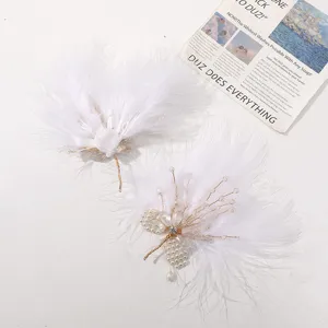 Handmade white feather hair clips with pearls crystals for vintage hanfu styling detail view.