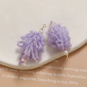 Detailed view of handmade purple crystal beaded pinecone pendant DIY jewelry making component.
