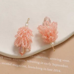 Pink crystal pinecone bead detail shot, handmade DIY charm for earrings and hair accessories.
