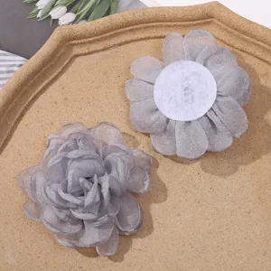 Close-up detail view of grey organza burnt edge flower DIY handmade craft accessory.
