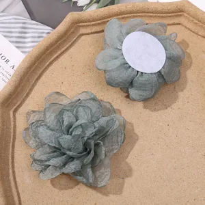 Grey organza burn-edge flower DIY craft material, detailed view of hair accessory pieces.