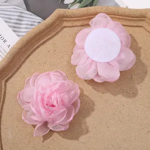 Close up of pink organza burnt edge mesh flower DIY handmade hair accessory material.