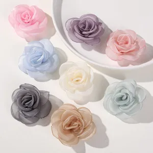 Colorful mesh fabric rose flowers perfect for DIY handmade hair accessories and crafts.