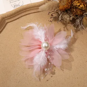 Pink mesh flower hair accessory with feathers and pearl tassels for DIY hair crafts.