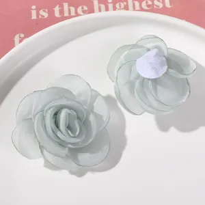 Close-up detail of light green organza mesh flower DIY handmade hair accessories material