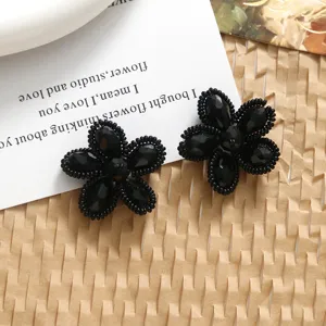 Handmade black crystal woven flower DIY accessories for earrings, hair clips and jewelry making.