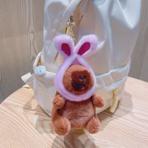 Cute capybara plush keychain with pink bunny ears hat, soft stuffed animal bag pendant.