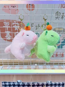 Cute capybara plush keychain with orange charm, soft cartoon bag pendant ornament.