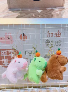 Cute capybara plush keychain detail shot, soft stuffed animal bag charm pendant, orange decor.