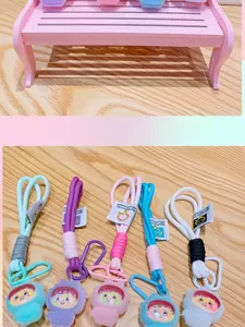 Cute cartoon doll keychain set with colorful lanyard and hook for bag decoration.