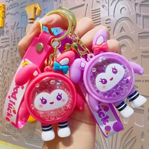 Cute cartoon rabbit keychain with liquid floating beads and silicone strap for bags.