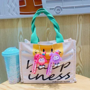 Cute rabbit keychain canvas tote bag with scented pendant and fresh green handles for daily use.