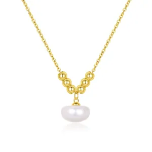 Detailed close-up of the gold-plated S925 silver necklace with metal beads and pearl pendant.