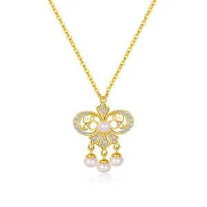 Elegant pearl pendant necklace with gold plated chain, vintage style jewelry item.