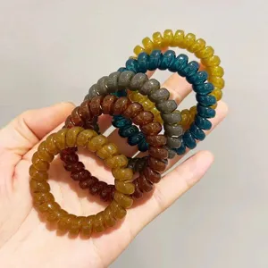 Set van spiraalvormige telefoonkoord haarelastiekjes, kleurrijke plastic haarcoils voor dames.