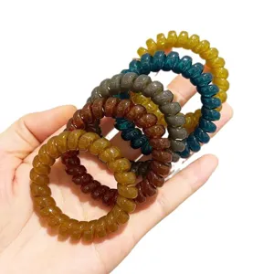 Kleurachtige plastic spiraal haarelastiekjes, duurzame paardenstaart houders voor vrouwen.