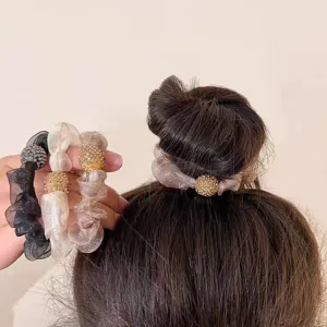 Elegant organza hair scrunchies with sparkling ball details, perfect for cute ponytails.