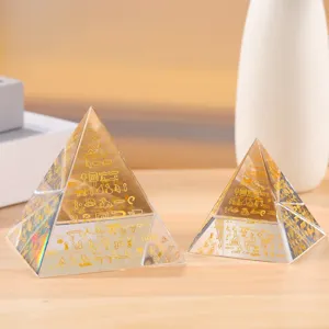 Ancient Egyptian style crystal pyramid detail, clear glass prism energy tower decor.
