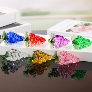 Detailed view of colorful crystal glass grape figurines, perfect for home decor display.