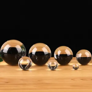 Crystal glass spheres display closeup showing transparent optical quality and smooth surface.