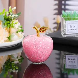 Crystal glass apple figurine with pink crystal beads, gold stem and rhinestone leaves for decor.