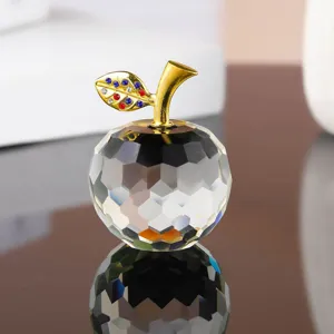 Exquisite crystal apple figurine detail featuring a gold stem and sparkling rhinestones.