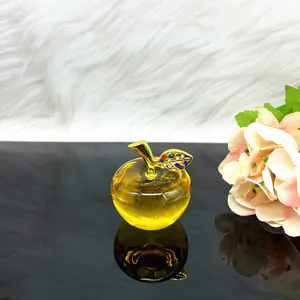 Crystal apple ornament with golden stem and sparkling rhinestones for home decor detail.