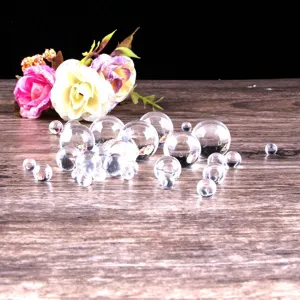 Clear glass beads detail shot, transparent crystal balls in assorted sizes for decoration craft.