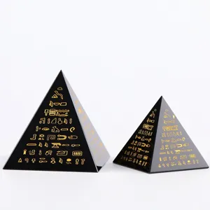 Black crystal pyramid ornament with gold Egyptian hieroglyphs, mysterious home decor.