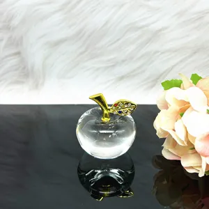 Crystal apple figurine detail shot, transparent glass ornament with rhinestone gold stem.