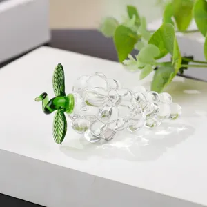 Close-up detail of the clear crystal glass grape ornament, showing exquisite craftsmanship and texture.