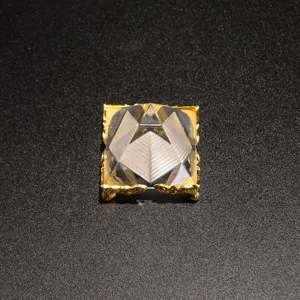 Clear crystal pyramid ornament with gold metal base for home office decor detail view