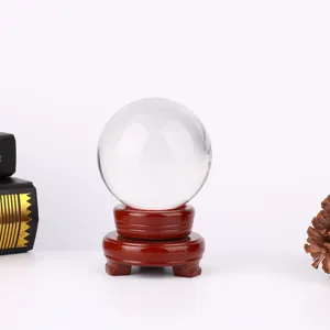 Clear crystal glass ball with wooden base home decor ornament transparent sphere display.