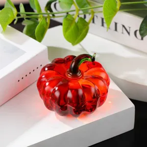 Red crystal glass pumpkin ornament detail, exquisite miniature decor piece for office desk.