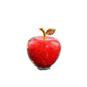 Crystal glass apple ornament with red crystal stone fill and rhinestone leaf for home decor and gift.