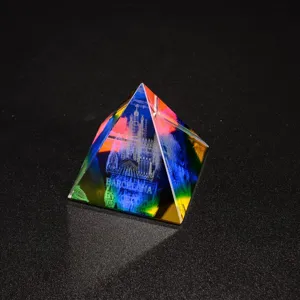 Crystal pyramid ornament laser engraved with city architecture and Barcelona text for decor.